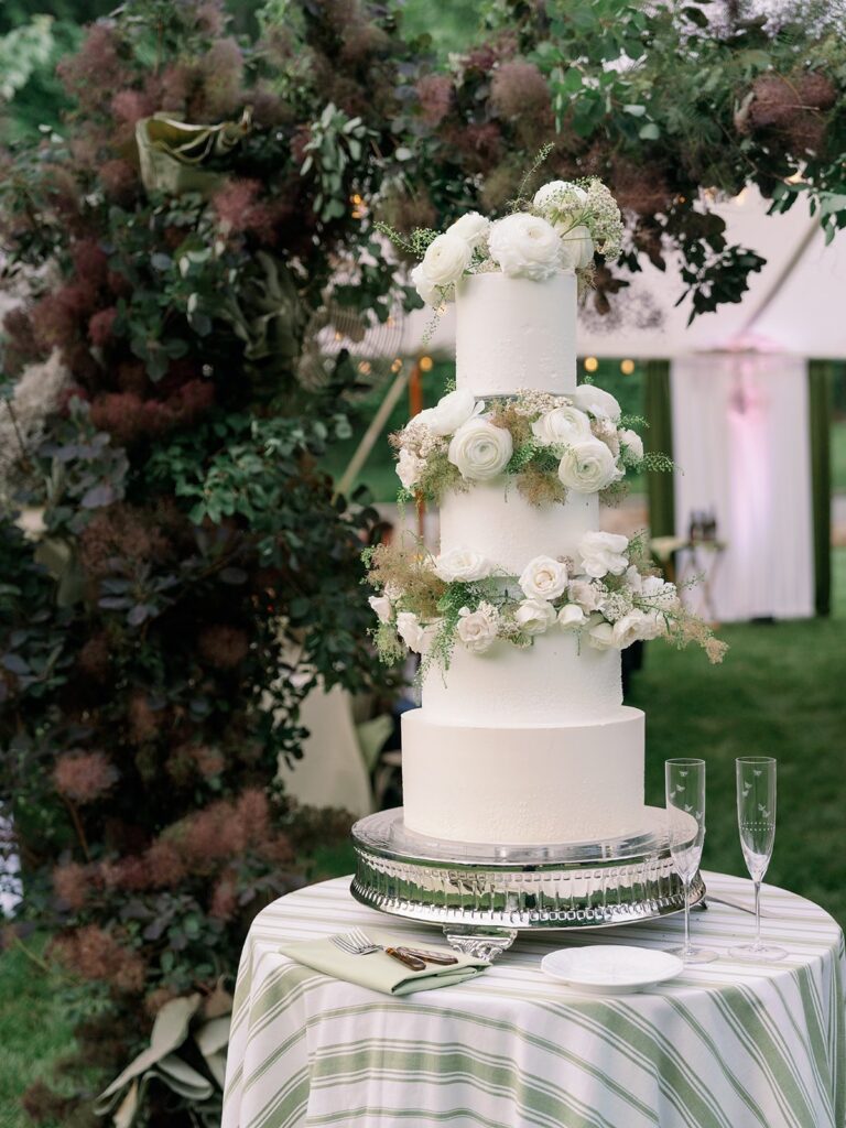 Wedding cake with natural botanicals at Bramblewood Estate outdoor tent, a Charlottesville wedding venue