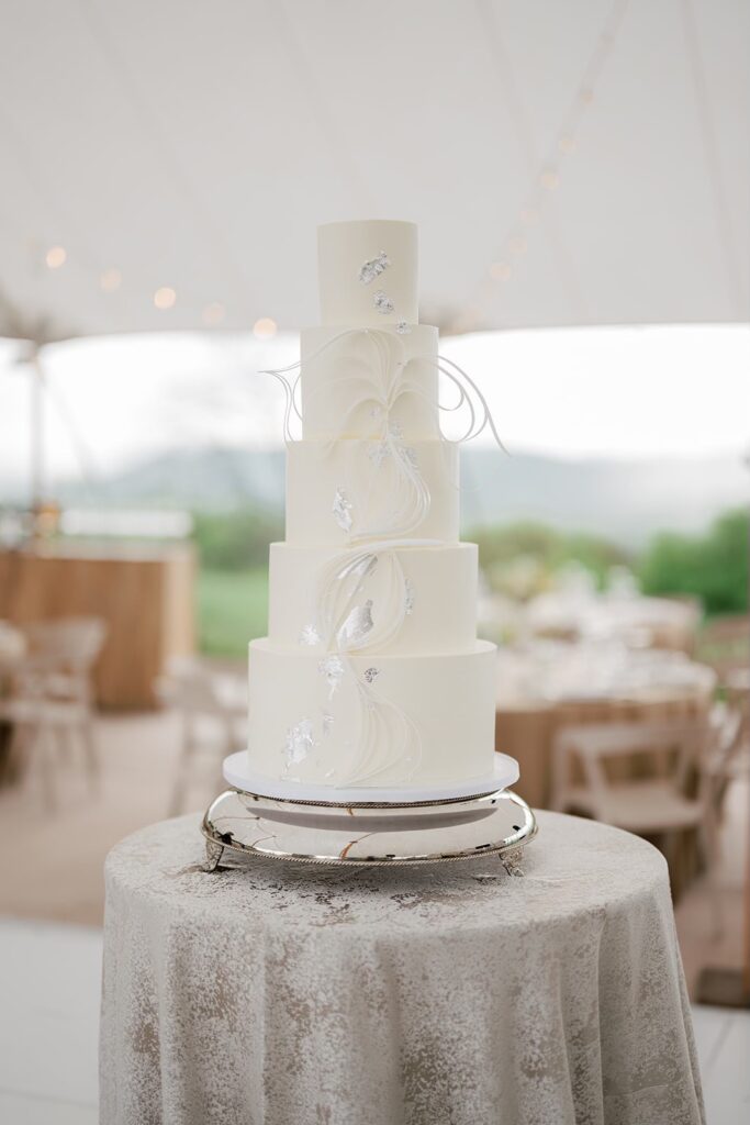 Sculptural Pantone Cloud Dancer white wedding cake displayed at a Virginia wedding venue