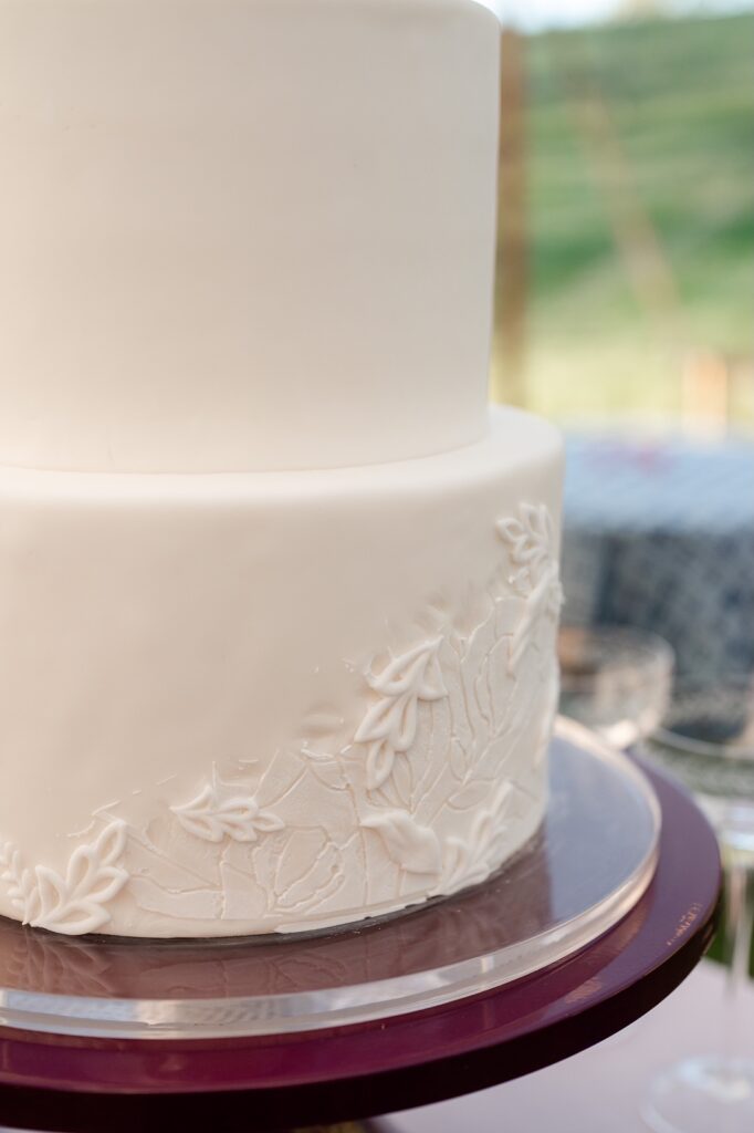 Close up of Pantone Cloud Dancer wedding cake featuring hand crafted details and texture