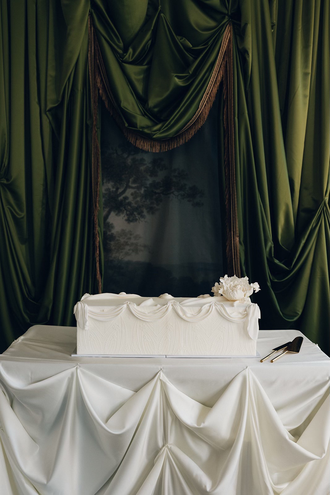 Luxury white wedding cake with layered texture and refined neutral palette